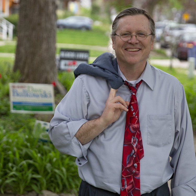 Portrait of Dave Bulkowski smiling outdoors in Grand Rapids.